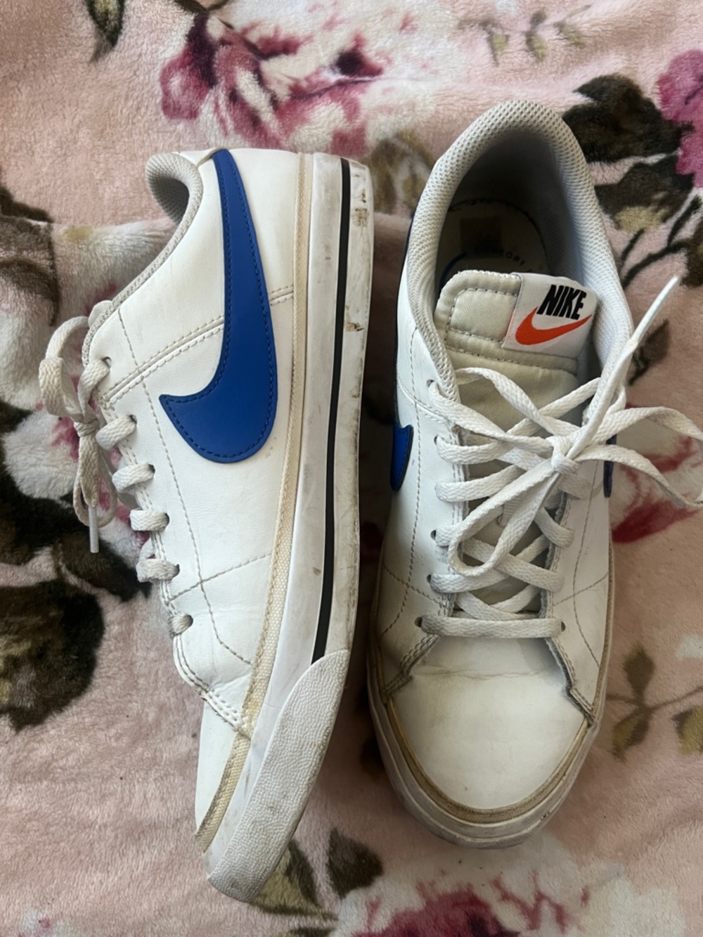 Nike White Sneakers with Blue Swoosh and Orange Tongue Logo